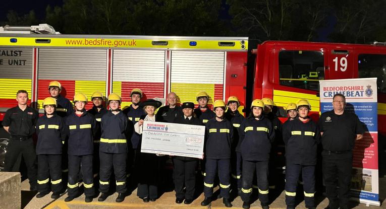 Fire Cadets and High Sheriff of Bedfordshire, Camilla King, in front of a fire engine